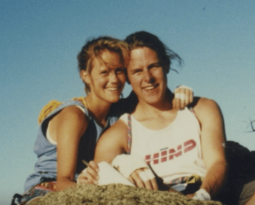 Photo of Amy Wroe Bechtel posing and smiling outdoors with her husband, Steve