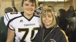 Tom Brown is pictured, smiling, with his mother.